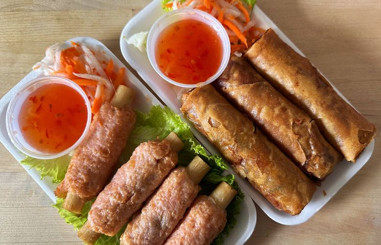 These are the vegetable egg rolls and mia chao tom from Hong Kong Market. The latter: little skewers of minced shrimp and crab formed around sugar cane stalks and flash-fried, served with pickled daikon, carrots and a Thai chili sauce.