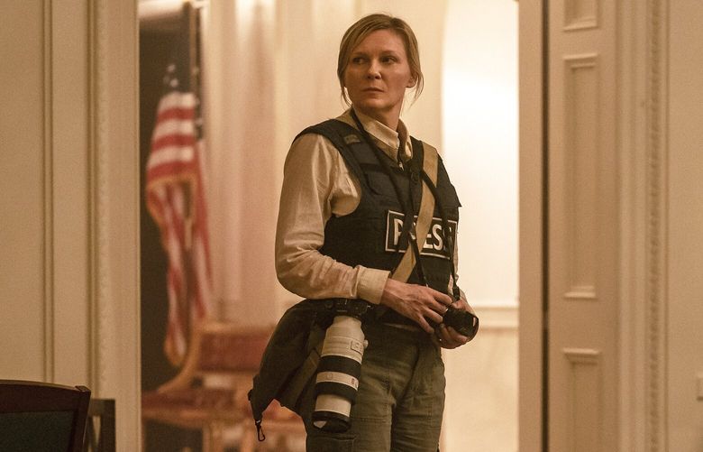 This image released by A24 shows Kirsten Dunst in a scene from “Civil War.” (Murray Close/A24 via AP) NYET645 NYET645
