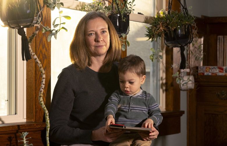 Cari Campbell, who received fertility treatment in Minnesota and was charged thousands of dollars that her insurer had labeled “you saved,” with her young son Sam at home in Minneapolis, Nov. 17, 2023. When health insurers route claims through MultiPlan, some patients receive statements highlighting what their insurer calls discounts or savings – even as doctors or hospitals bill them for those amounts. (Jenn Ackerman/The New York Times)
