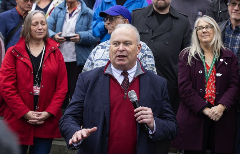 Jim Walsh, chair of the Washington State Republican Party and a state representative from Aberdeen, foreground, speaks during a rally to urge Democratic lawmakes to hold hearings to consider GOP initiatives, Wednesday, Jan. 31, 2024 in Olympia.