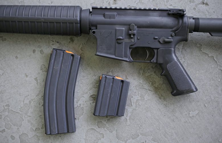 A Stag Arms AR-15 rifle with 30 round, left, and 10 round magazines in New Britain, Conn., Wednesday, April 10, 2013. (AP Photo/Charles Krupa) CTCK10