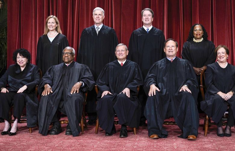 FILE – Members of the Supreme Court sit for a new group portrait following the addition of Associate Justice Ketanji Brown Jackson, at the Supreme Court building in Washington, Oct. 7, 2022. Bottom row, from left, Associate Justice Sonia Sotomayor, Associate Justice Clarence Thomas, Chief Justice of the United States John Roberts, Associate Justice Samuel Alito, and Associate Justice Elena Kagan. Top row, from left, Associate Justice Amy Coney Barrett, Associate Justice Neil Gorsuch, Associate Justice Brett Kavanaugh, and Associate Justice Ketanji Brown Jackson. (AP Photo/J. Scott Applewhite, File) WX101