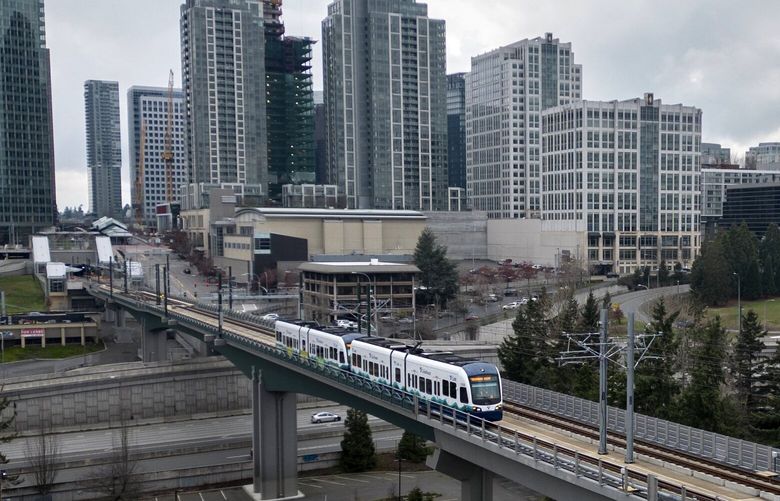 A link light rail train heads from the Bellevue Downtown station, over I-405, towards the Wilburton Station  in Bellevue Tuesday, February 8, 2024.  


Sound Transit link light rail test trains are running between Redmond Technology Station and South Bellevue Station in Bellevue.  Full speed practice tests, called “simulated revenue service,” just began.  

 226075