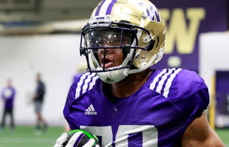 UW running back Tybo Rogers (20) practices at Dempsey Indoor Center Monday, April 3, 2023. 
 223459