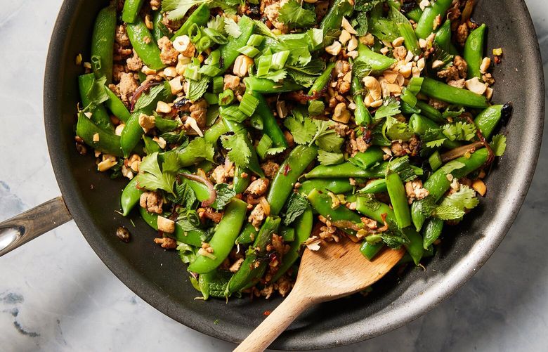 Spicy skillet ground turkey and snap peas. This easy Melissa Clark recipe, inspired by the zesty, pungent flavors of larb, turns unassuming ground turkey into a star. Food styled by Cyd Raftus McDowell. (Christopher Testani/The New York Times) XNYT0802