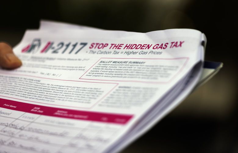 A petition with signatures against the gas tax is seen at a Future 42 and Americans for Prosperity co-sponsored event where they roll back gas prices to the national average at a filling station — $3.829 a gallon — in Kent, Wednesday, Sept. 13, 2023.