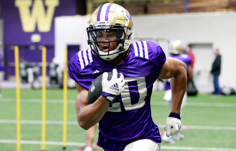 UW running back Tybo Rogers (20) practices at Dempsey Indoor Center Monday, April 3, 2023. 
 223459
