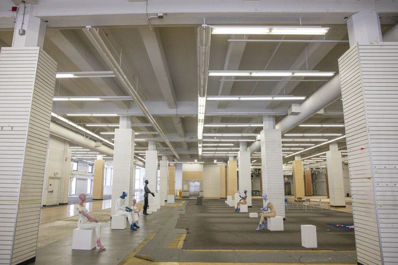The interior of the former Bed Bath & Beyond store in downtown Seattle will be converted into an arts center. Among the changes: A gallery wall will replace a row of mannequins, and a former break room will become a black box theater. (Ivy Ceballo / The Seattle Times)