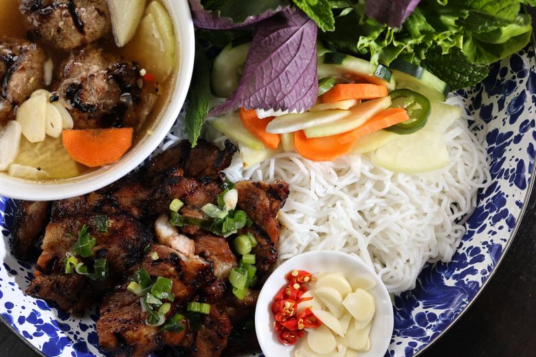 This is the rightfully popular bún chả Hanoi at Seattle’s Ba Bar. It features pork sausage patties, marinated pork belly, rice noodles, lettuce, herbs, peanuts, shallot, pickled daikon and carrot, cucumber and bean sprouts. (Karen Ducey / The Seattle Times)