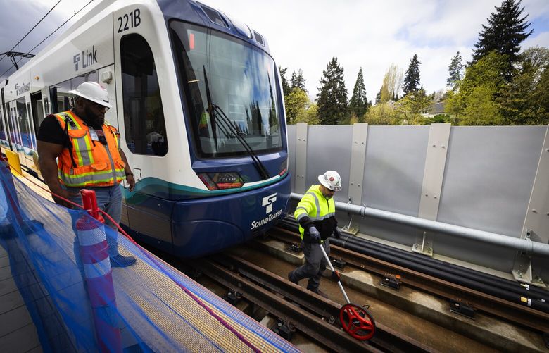Workers take measurements during “safe break testing” at South Bellevue Station, Tuesday, April 9, 2024 in Bellevue. Sound Transit’s latest light rail rollout, the 2 Line between South Bellevue and Redmond Technology Station, is opening April 27.