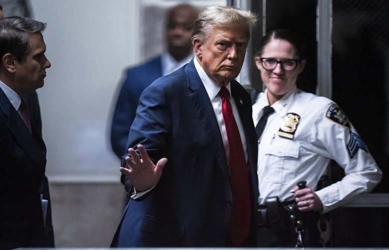 Trump returns to the courtroom following a break at the Manhattan criminal court ahead of jury selection on Monday. MUST CREDIT: Jabin Botsford/The Washington Post
