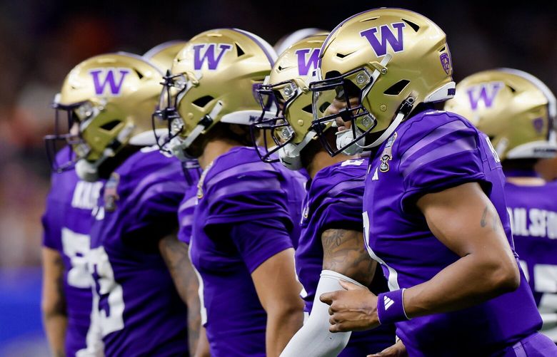 Washington Huskies quarterback Michael Penix Jr. leads his offense back onto the field during the fourth quarter of the Sugar Bowl Monday, Jan. 1, 2024 in New Orleans. 225854