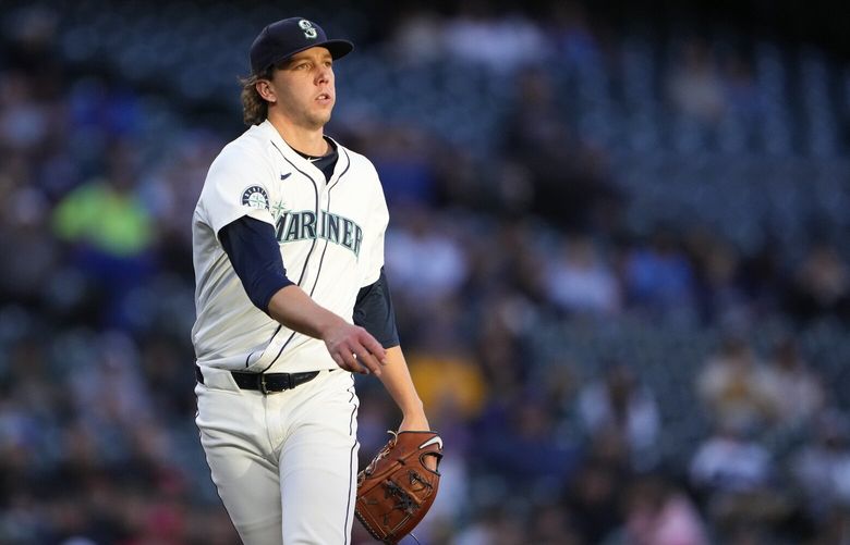 Seattle Mariners starting pitcher Logan Gilbert walks back to the mound after pitching in the third inning of a baseball game against the Cincinnati Reds, Tuesday, April 16, 2024, in Seattle. (AP Photo/Lindsey Wasson) WALW206 WALW206