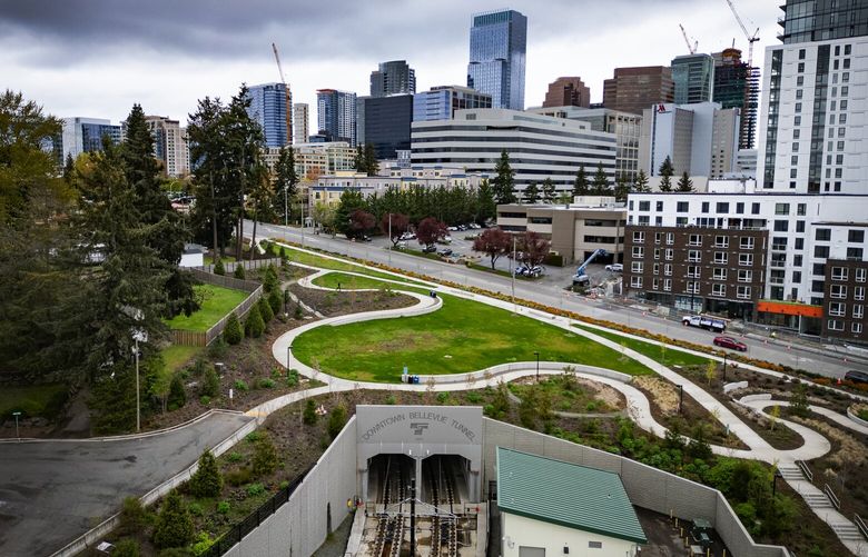 The south portal to the 2 Line’s tunnel is located at the East Main Station, seen from the air, Tuesday, April 9, 2024, with downtown Bellevue in the background. Sound Transit’s latest light rail rollout, the 2 Line between South Bellevue Station and Redmond Technology Station, is opening April 27.