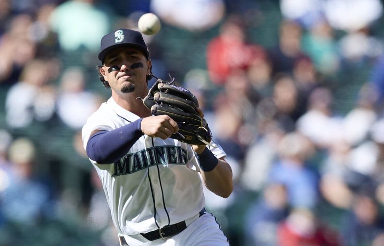 Seattle Mariners third baseman Josh Rojas throws out Cincinnati Reds’ Jonathan India at first during the ninth inning of a baseball game, Wednesday, April 17, 2024, in Seattle. The Mariners won 5-1. (AP Photo/John Froschauer) WAJF120 WAJF120