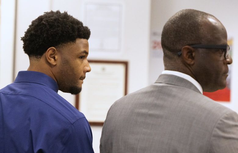 Tylin “Tybo” Rogers, left, with his attorney Robert Flennaugh II during an arraignment where Rogers pled not guilty to two alleged rape charges, Thursday, April 18, 2024 in Seattle. “He plans to fight every inch of these false claims,” Flennaugh said in a statement.