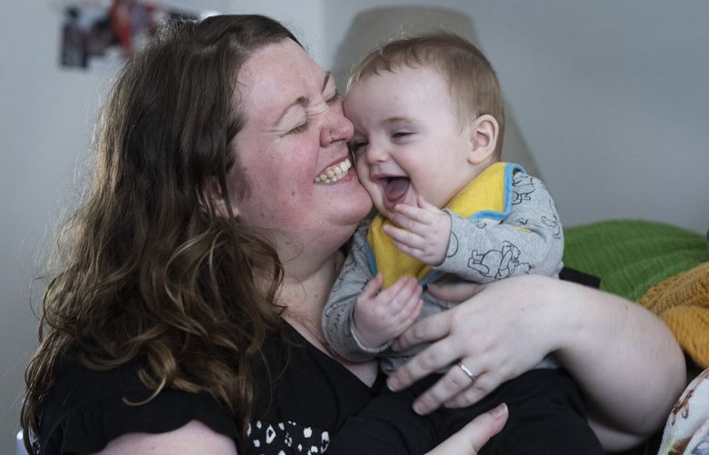 Nicole Slemp, a new mother of seven-month-old William, holds her son in their Auburn home.  Slemp recently quit her job because she and her husband couldn’t find child care they could afford. Expensive, scarce child care is putting Puget Sound parents out of work.   226355