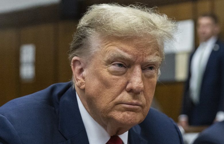 FILE – Former President Donald Trump attends jury selection at Manhattan criminal court in New York, April 15, 2024. Trump’s criminal hush money trial involves allegations that he falsified his company’s records to hide the true nature of payments to his former lawyer Michael Cohen, who helped bury negative stories about him during the 2016 presidential campaign. He’s pleaded not guilty. (Jeenah Moon/Pool Photo via AP, File) WX505 WX505