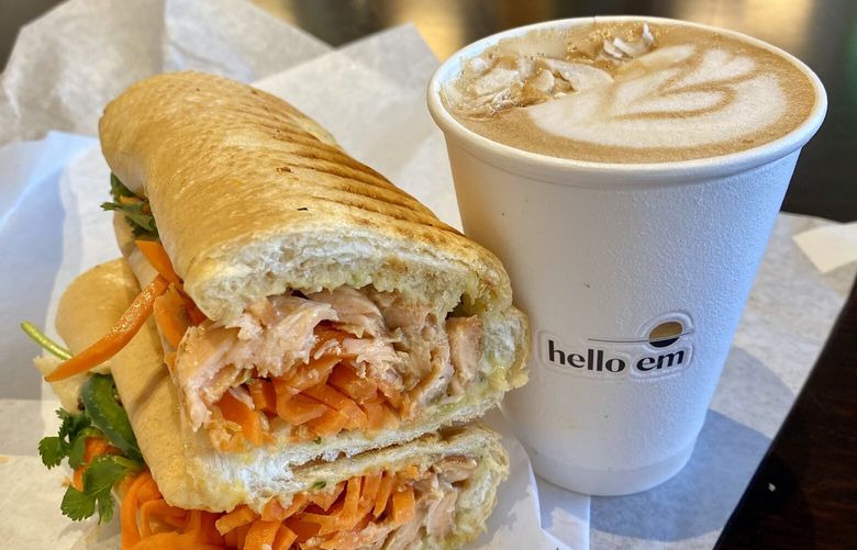At Hello Em in Seattle’s Little Saigon, it’s bánh mì k?p (that’s pressed, panini-style) with marinated salmon, lemongrass mayo, pickled veg, fried shallot, and cilantro, along with cà phê c?t d?a — robusta espresso with coconut cream.
