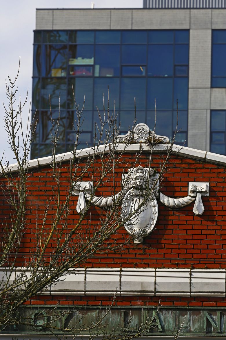 Despite its utilitarian function, the Troy Laundry building facade has handsome swag and shield terra-cotta ornament. (Mark Harrison / The Seattle Times, 2015)