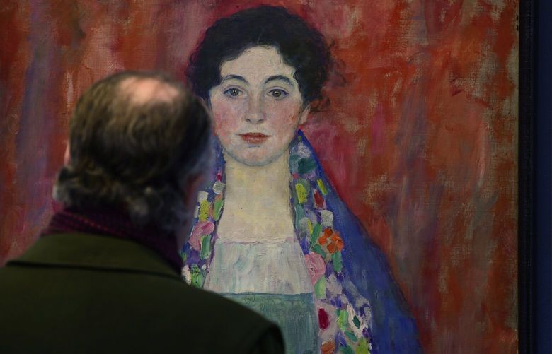 A man looks at the painting ‘Portrait of Fräulein Lieser’ by Austrian painter Gustav Klimt prior to an auction, in Vienna, Wednesday, April 24, 2024. A portrait of a young woman by Gustav Klimt that was long believed to be lost has been sold at an auction in Vienna for 30 million euros ($32 million). The Austrian modernist artist started work on the “Portrait of Fräulein Lieser” in 1917, the year before he died, and it is one of his last works. (AP Photo/Christian Bruna) CBR105 CBR105