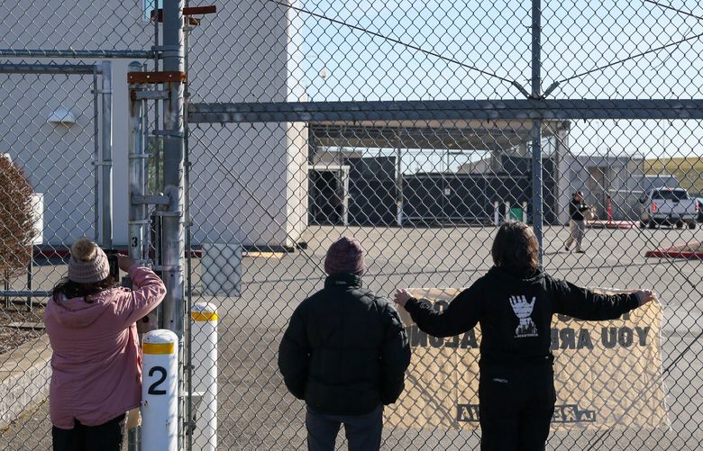Protestors stand vigil at the gates of the Northwest ICE Processing Center Friday morning in Tacoma, Washington, on March 15, 2024. 226441