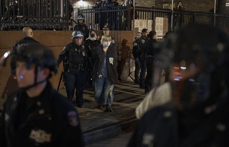 Pro-Palestinian protesters are arrested at New York University in Manhattan, Monday night, April 22, 2024. (Andres Kudacki/The New York Times)
 XNYT0770 XNYT0770