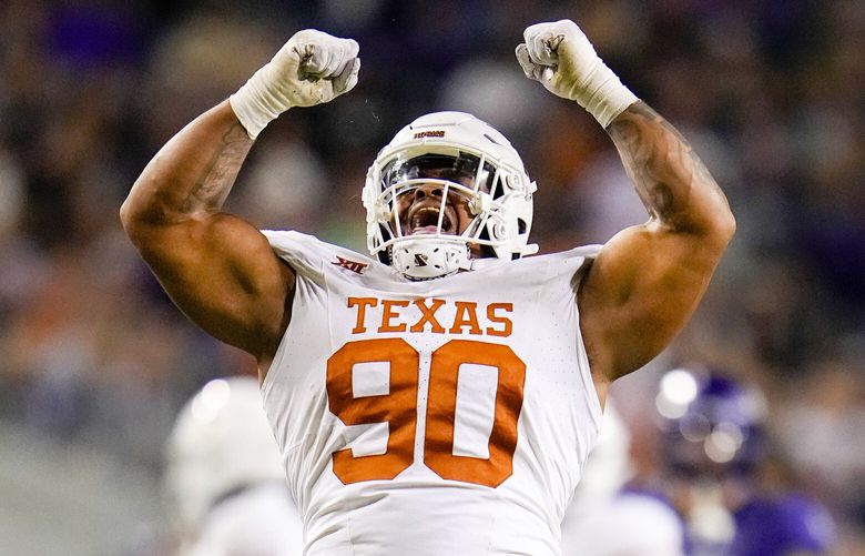 Texas defensive lineman Byron Murphy II reacts after collecting a sack against TCU during the first half of an NCAA college football game, Saturday, Nov. 11, 2023, in Fort Worth, Texas. (AP Photo/Julio Cortez) TXJC116