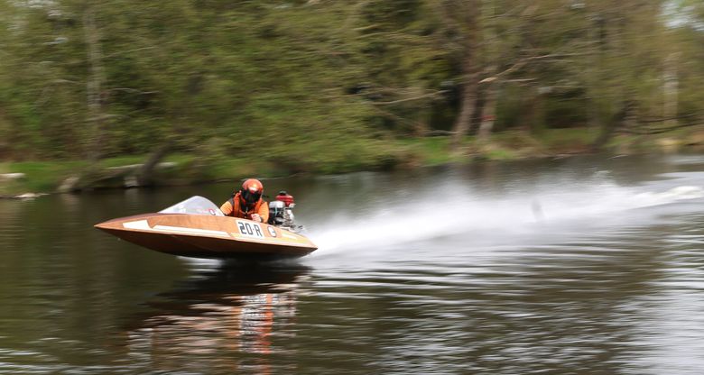 Kyle Bahl steers a runabout towards the finish line on the Sammamish River during the Kenmore Hydroplane Cup on April 13. The exhibition drew 17 drivers. (Karen Ducey / The Seattle Times)