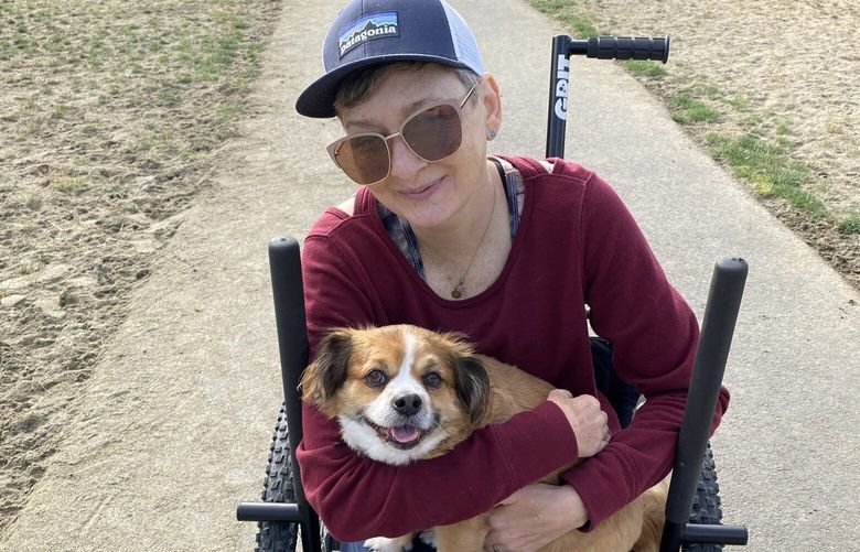 Carrie Lehner’s pup Barlow, seen here in Lehner’s arms at the dog park, “thinks he’s an emotional support dog,” said Lehner, who lives in Seattle. “He absolutely is not, but he’s very cute nonetheless.”