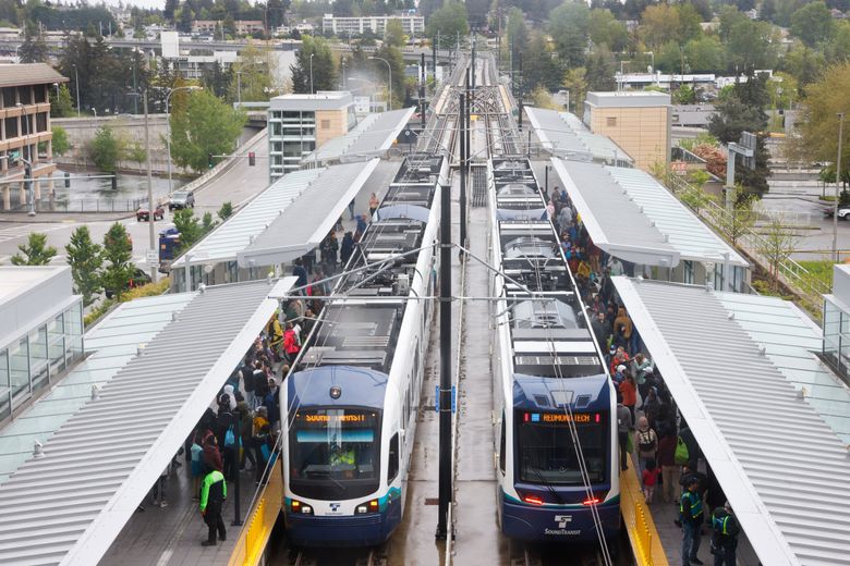 Trains pick up passengers on the Eastside light rail 2 Line at the Bellevue Downtown Station on Saturday.  (Karen Ducey / The Seattle Times)