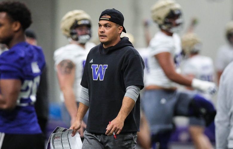 Inside linebackers coach Robert Bala works with his unit Monday.  The University of Washington held Spring Practice inside Dempsey Indoor Arena Monday, April 29, 2024. 226745