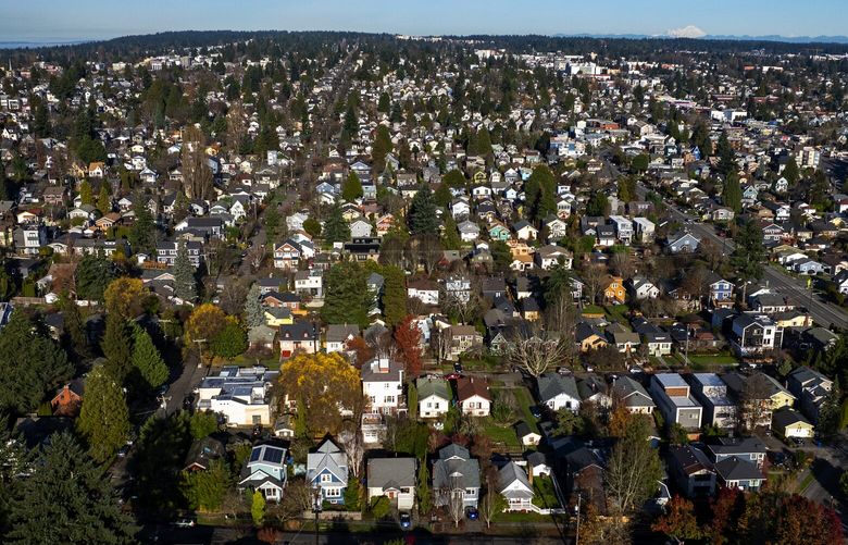 Seen from the air, Phinney Ridge single family homes along the westside of Green Lake, looking north toward Greenwood, Tuesday, Dec. 12, 2023 in Seattle.