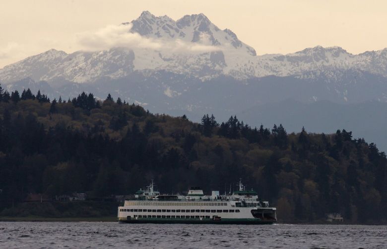 A ferry travels through Puget Sound with the Olympic Mountains in the distance Wednesday, April 10, 2024.  226590
