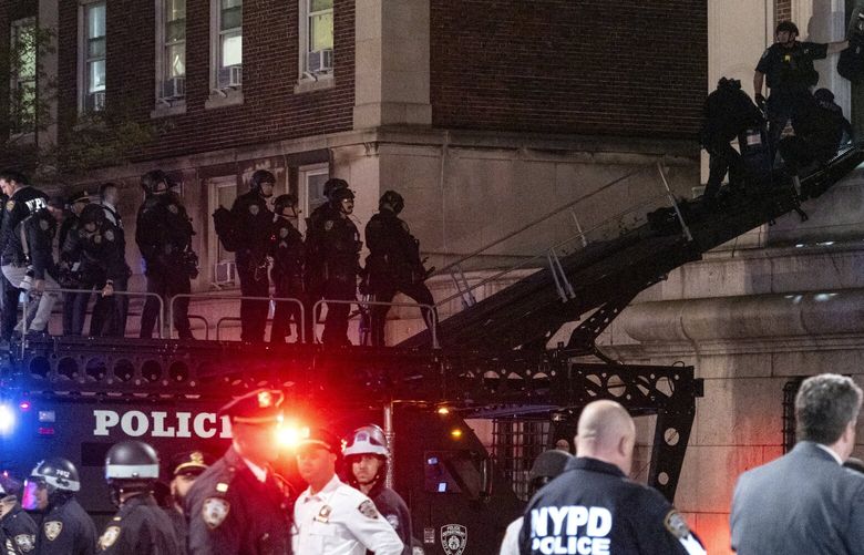Using a tactical vehicle, New York City police enter an upper floor of Hamilton Hall on the Columbia University campus in New York Tuesday, April 30, 2024, after a building was taken over by protesters earlier Tuesday. Hundreds of police officers swept into Columbia University on Tuesday night to end a pro-Palestinian occupation of an administration building and sweep away a protest encampment, acting after the school’s president said there was no other way to ensure safety and restore order on campus.(AP Photo/Craig Ruttle) NYCR109 NYCR109