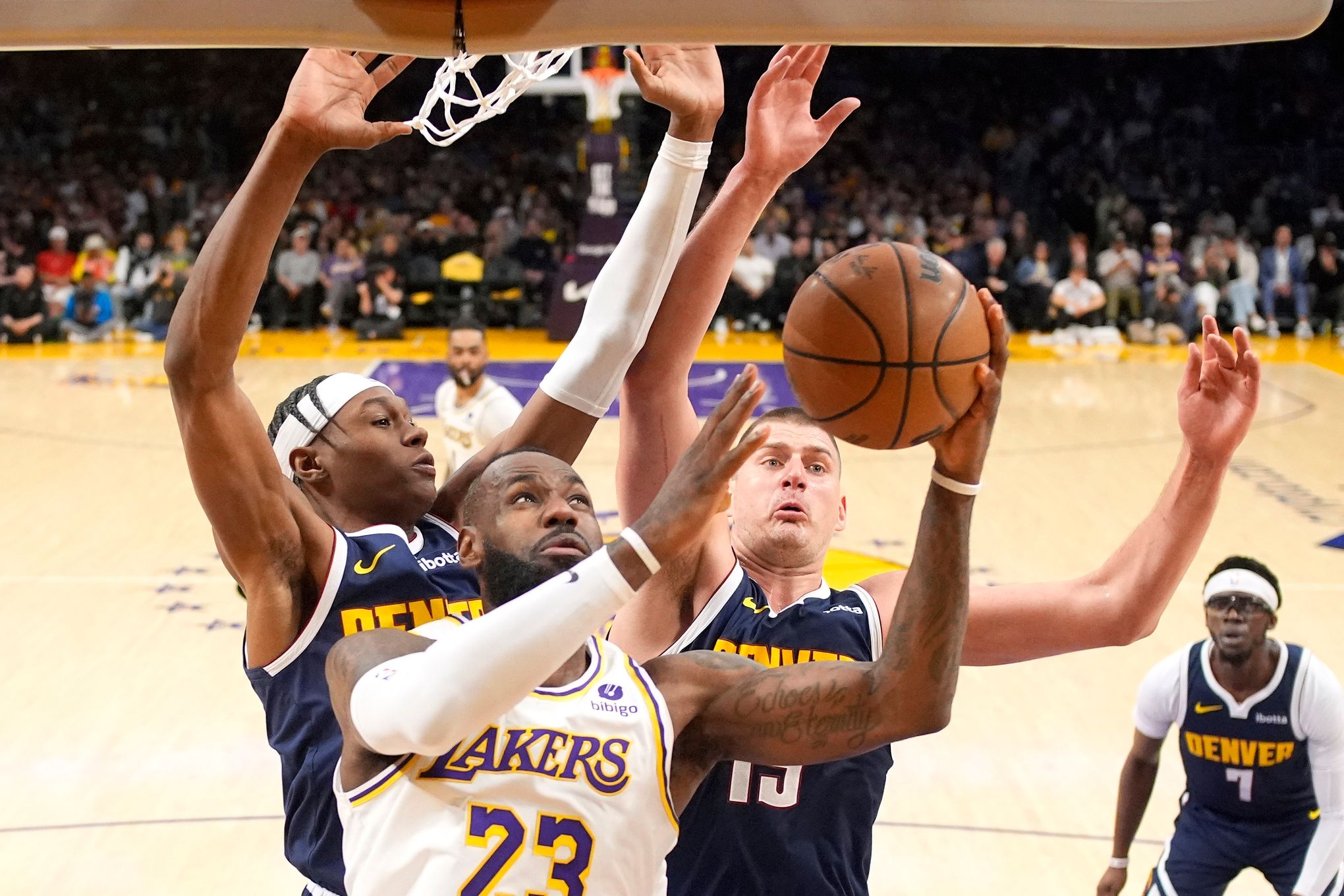 LeBron scores 30, and the Lakers avoid 1st-round elimination with a 119-108 win over champion Denver | The Seattle Times
