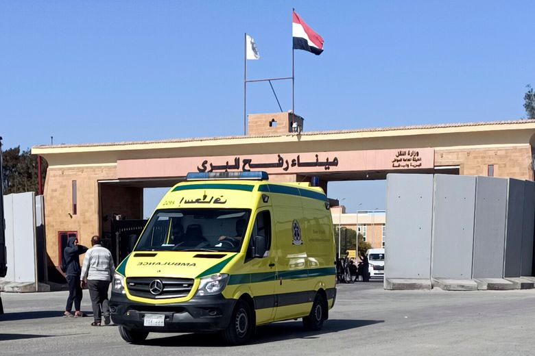 An ambulance carrying bodies of the foreign humanitarian aid workers killed in a recent Israeli airstrike in Gaza crosses the Rafah border crossing between Egypt and the Gaza Strip, Wednesday, April 3, 2024. (AP Photo/Ahmed Abudraa)