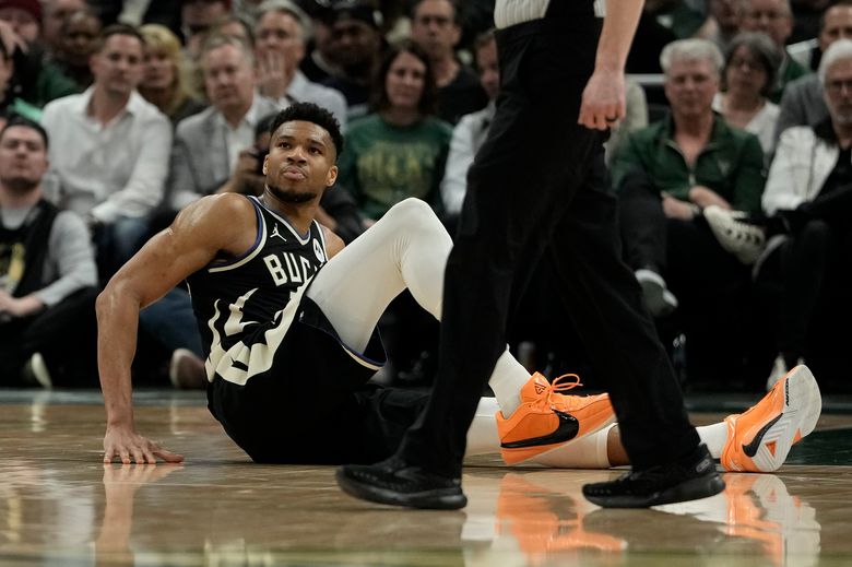 Bucks open their playoff run without Giannis Antetokounmpo because of left  calf strain | The Seattle Times
