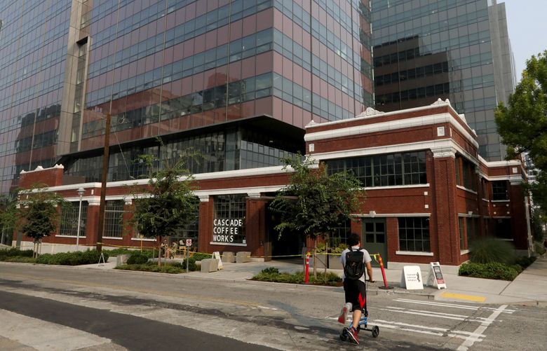 The Troy Block, comprising former Seattle Times property and the Troy Laundry, at Fairview Avenue and Thomas Street, with twin office towers behind the landmarked facade. (Alan Berner / The Seattle Times, 2018)