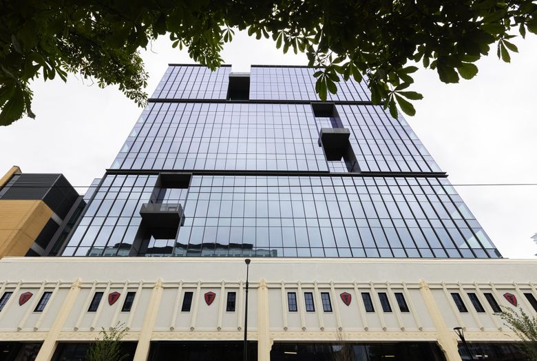 The facade of the iconic 1929 Firestone Rubber Company forms the base of 400 Westlake Ave. N., an office project by Martin Selig. (Ken Lambert / The Seattle Times, 2023)