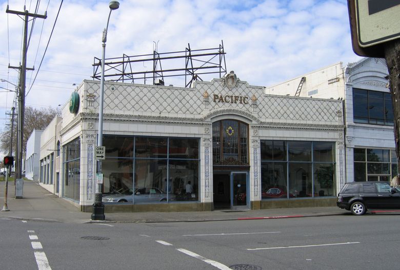 Vulcan developed a six-story office building at Westlake and Mercer on the site of the former Pacific Lincoln Mercury and William O. McKay Ford dealerships. (Courtesy Washington Trust for Historic Preservation)