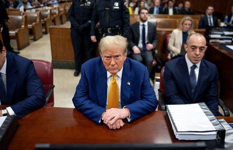 Former President Donald Trump, center, at his criminal trial in Manhattan on Thursday, May 2, 2024. Keith Davidson, the former lawyer for the porn star Stormy Daniels, faced a blistering cross-examination on Thursday in the criminal trial of Donald J. Trump, with defense lawyers casting him as a serial extortionist of celebrities. (Doug Mills/The New York Times) XNYT0259 XNYT0259