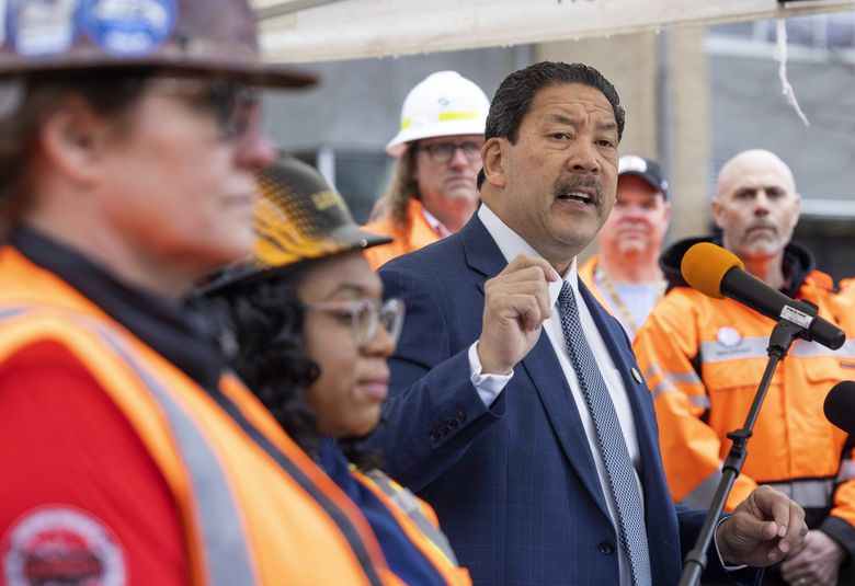 Mayor Bruce Harrell  speaks at a press conference on April 2, during which he proposed a new transportation levy that would have raised  $1.35 billion over eight years. On Friday, Harrell announced a revised proposal that would raise $1.45 billion. (Ellen M. Banner / The Seattle Times)