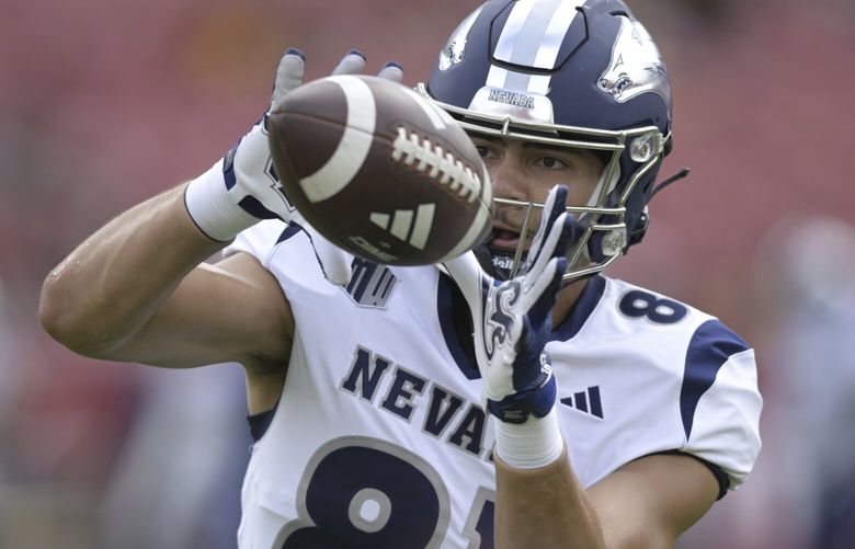 Nevada tight end Keleki Latu (81) warms up to play Southern California during an NCAA football game on Saturday, Sept. 2, 2023, in Los Angeles. (AP Photo/John McCoy)