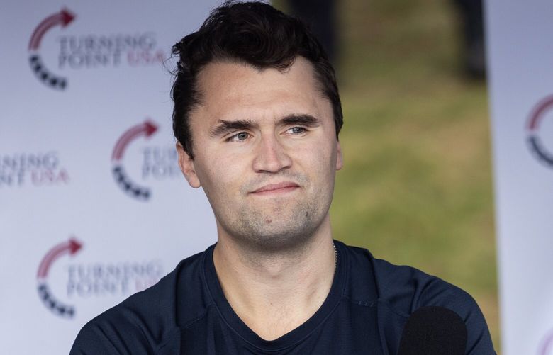 Charlie Kirk, founder of Turning Point USA, listens to a question from a student during a debate and question session at the University of Washington on Tuesday, May 7, 2024, in Seattle.
