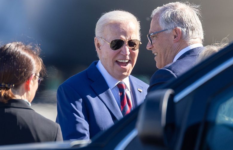 United States President Joe Biden greets Jay Inslee, Washington State Governor, in the receiving line Friday afternoon at SeaTac International Airport in SeaTac, Washington, on May 10, 2024 226916 (Kevin Clark / The Seattle Times)