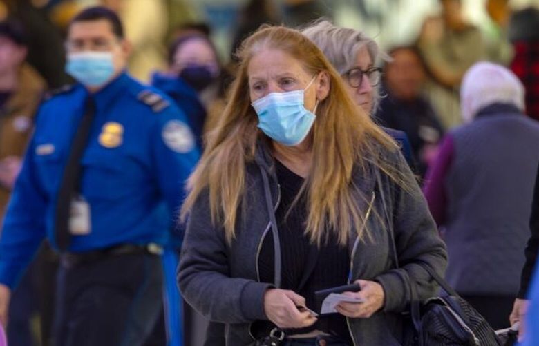 Passengers, with and without face mask, at Los Angeles International Airport on Wednesday, Jan. 10, 2024, in Los Angeles, California. (Irfan Khan/Los Angeles Times/TNS)