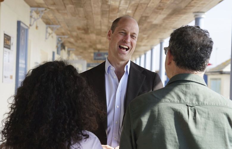 Britain’s Prince William, the Prince of Wales, known as the Duke of Cornwall when in Cornwall, reacts during a visit to St. Mary’s Harbour, the maritime gateway to the Isles of Scilly, England, to meet representatives from local businesses operating in the area, Friday May 10, 2024. (Ben Birchall/PA via AP) amb806 amb806