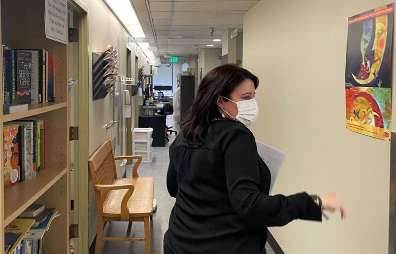 Allison West, area manager of King County’s Downtown Public Health Center, walks through the clinic’s primary care unit. The county has said that its 10 public health clinics are in danger of closing due to a budget crunch.