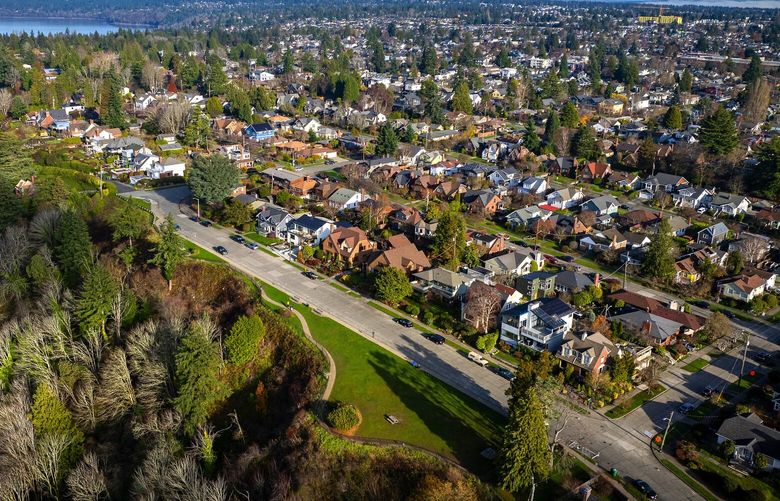 Single family homes in the north Ballard neighborhood of Seattle as seen from the air with Sunset Hill Park in the foreground, Dec. 12, 2023.